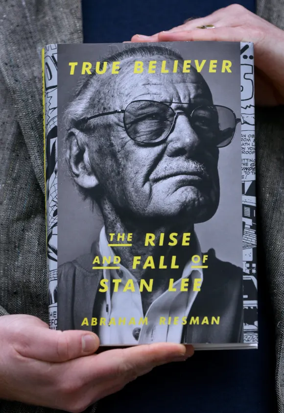 Syndication: The Providence Journal, \ True Believer: The Rise and Fall of Stan Lee\ was written by Abraham Riesman, a l