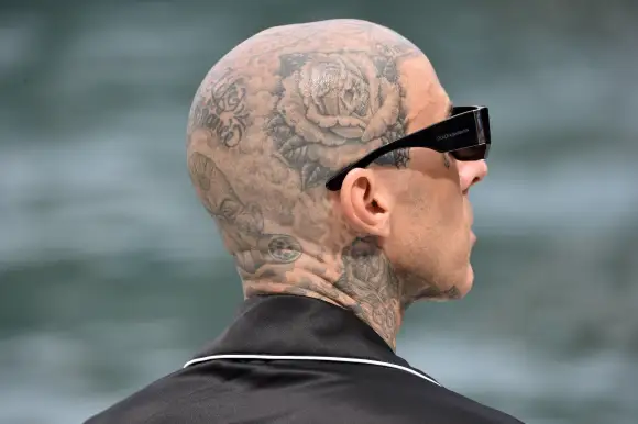 Kourtney Kardashian and Travis Barker the day after their wedding dive dressed in the sea and relax on a boat with the