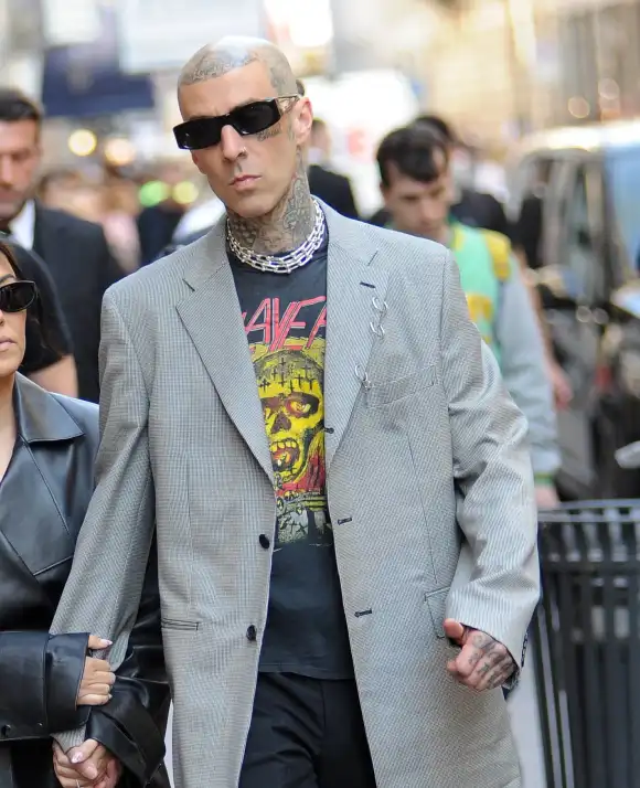 Kourtney Kardashian And Travis Barker Walk Hand-In-Hand - Milan Kourtney Kardashian and Travis Barker appeared to be as