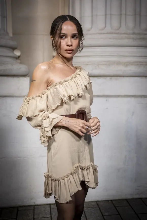 Zoë Kravitz visits the Saint Laurent hommes show at Fashion Week in Paris